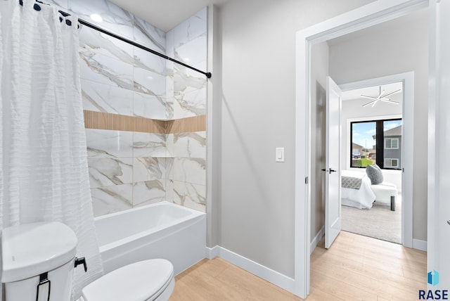 bathroom with wood-type flooring, shower / tub combo with curtain, and toilet