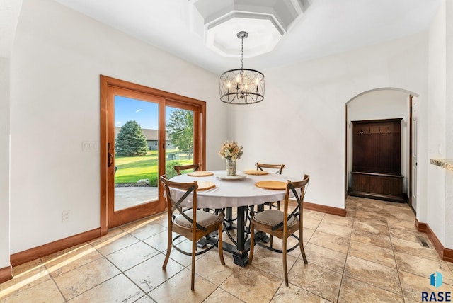 dining space with a notable chandelier