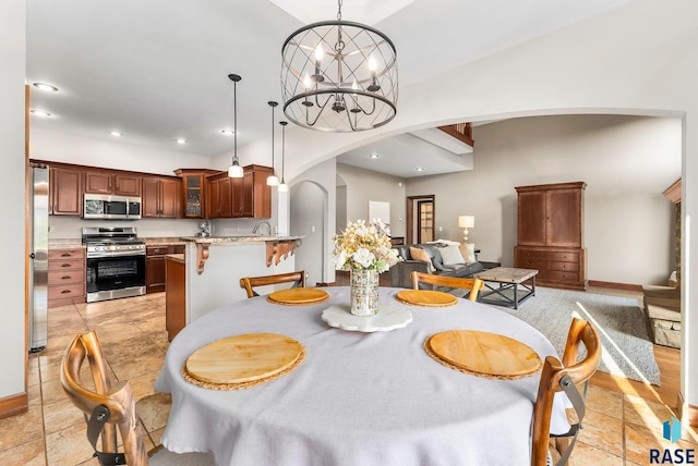 dining room with a notable chandelier and sink