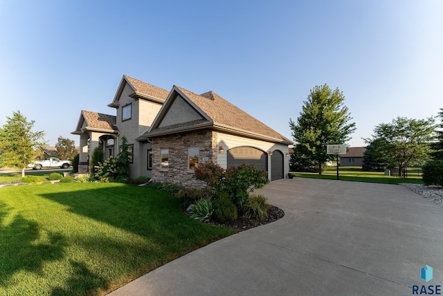 view of side of home with a lawn and a garage