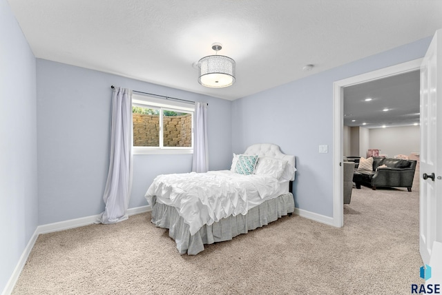 carpeted bedroom featuring a textured ceiling