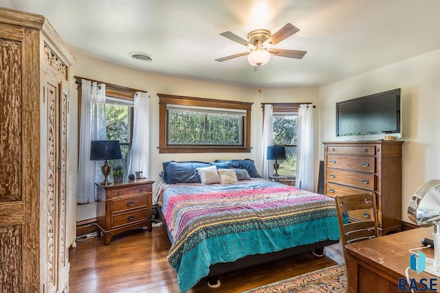 bedroom featuring ceiling fan and dark wood-type flooring