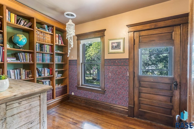 unfurnished room with wood-type flooring