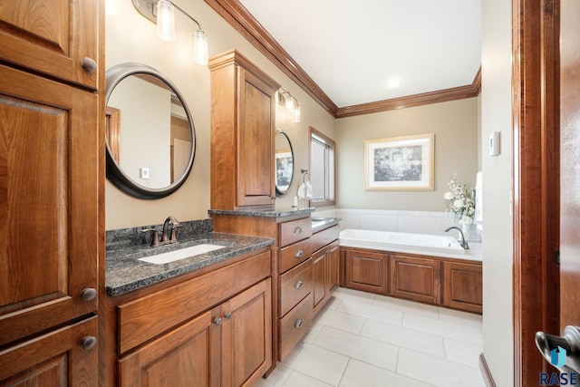 bathroom featuring a washtub, vanity, tile patterned floors, and ornamental molding