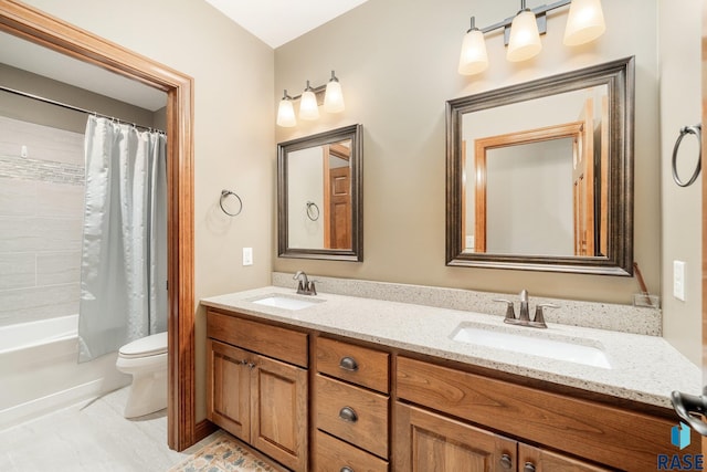 full bathroom with vanity, shower / bath combination with curtain, and toilet