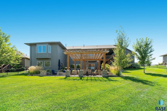 back of house with a yard, a pergola, and a patio area