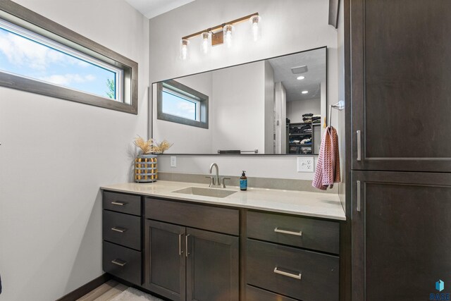 bathroom with baseboards and vanity