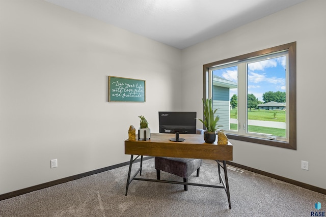 carpeted home office with baseboards and visible vents