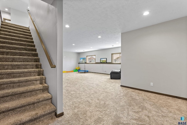 interior space with baseboards, recessed lighting, and carpet