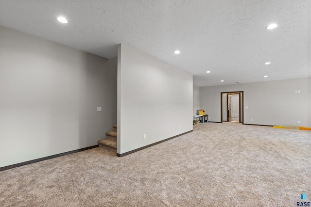 below grade area featuring carpet, baseboards, and recessed lighting