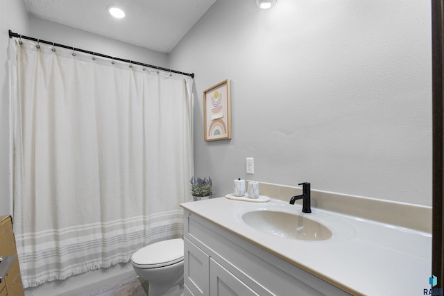 full bath with toilet, vanity, and shower / bath combo with shower curtain