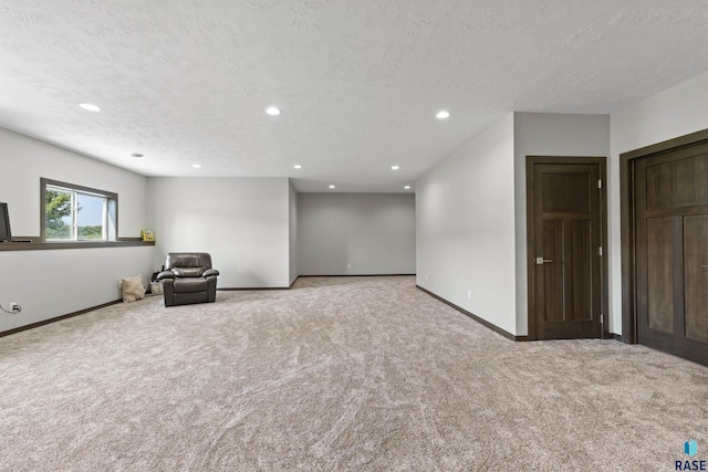 unfurnished room with baseboards, carpet flooring, and recessed lighting