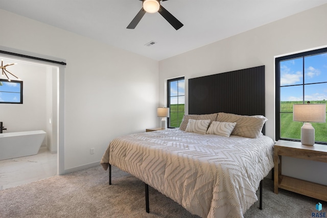bedroom with ceiling fan, carpet floors, visible vents, and baseboards