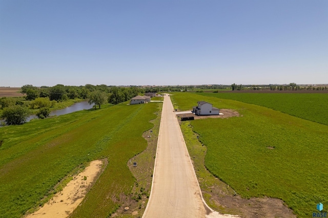 aerial view with a water view and a rural view