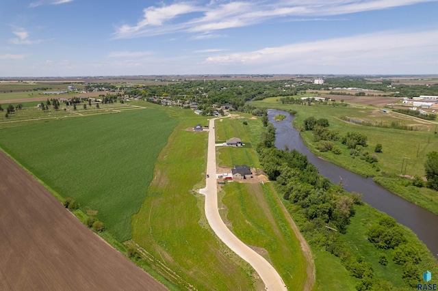 birds eye view of property with a rural view and a water view