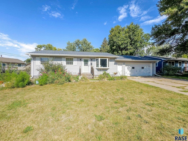 ranch-style home with a front yard and a garage