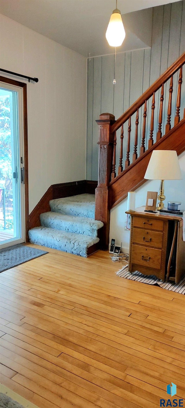 staircase featuring wood-type flooring