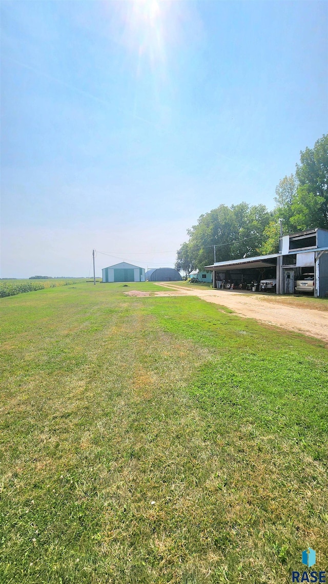 view of yard with a rural view