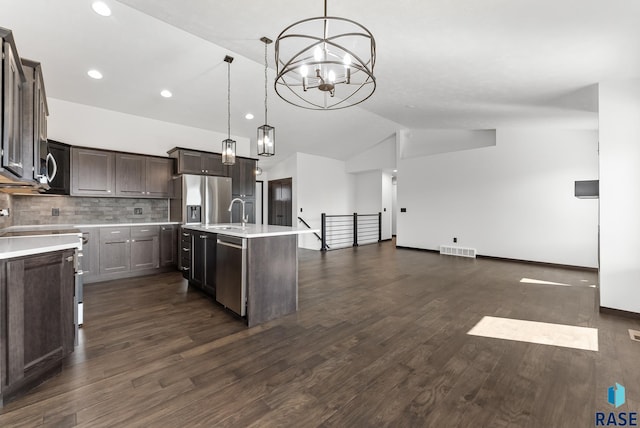 5413 E 64th St, Sioux Falls, SD 57108 - kitchen featuring lofted ceiling, visible vents, appliances with stainless steel finishes, and light countertops