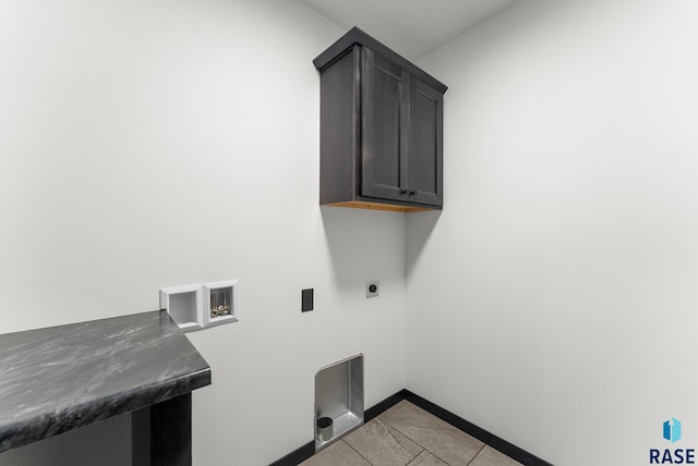 laundry area with hookup for a washing machine, light tile patterned flooring, electric dryer hookup, and cabinets