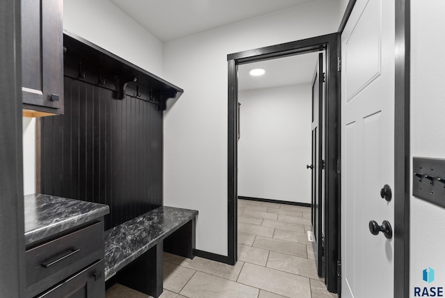 mudroom with light tile patterned flooring