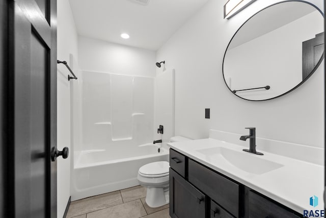 full bathroom with vanity, toilet,  shower combination, and tile patterned floors