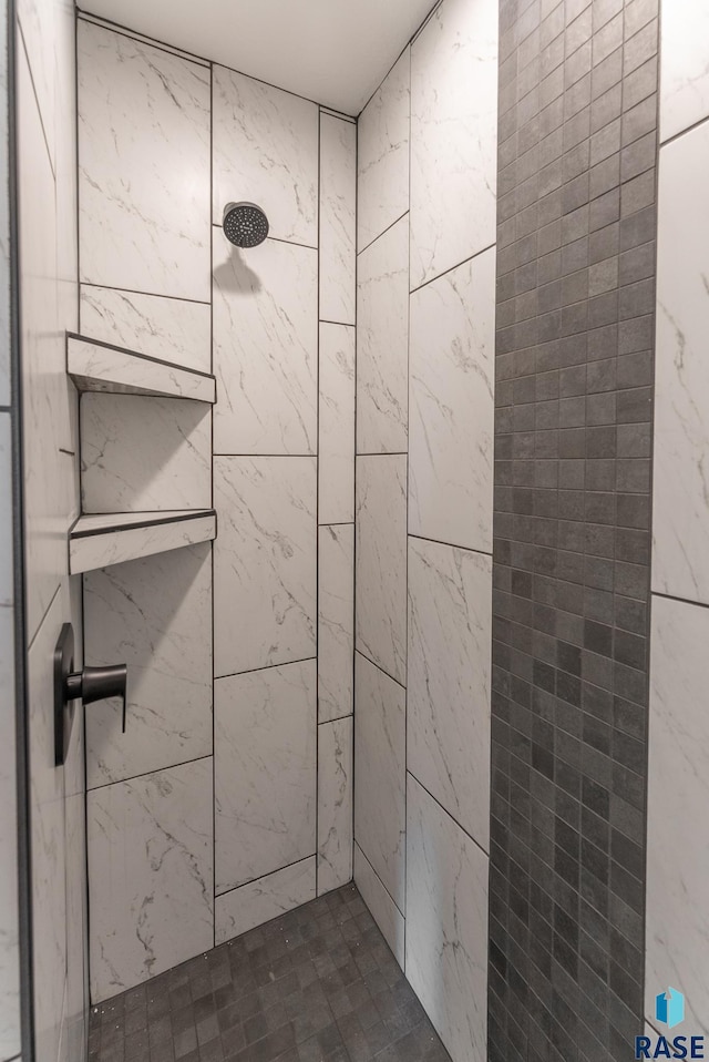 bathroom with tiled shower