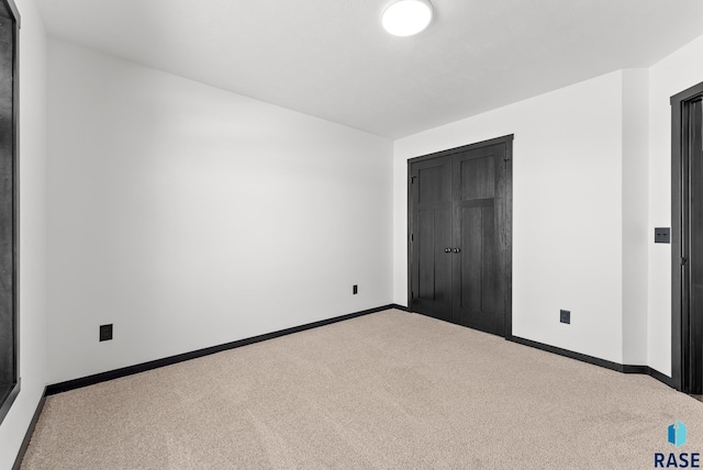 unfurnished bedroom featuring carpet