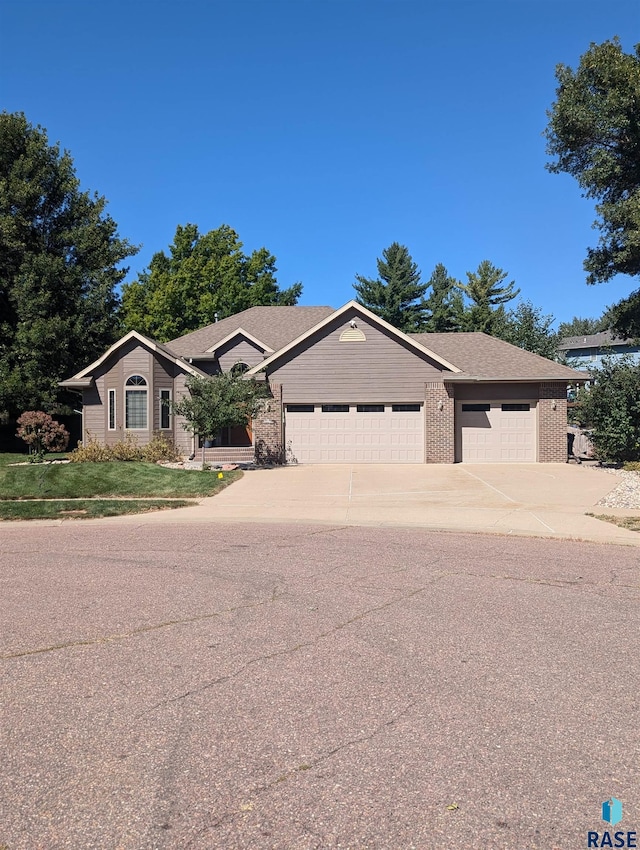 single story home featuring a garage