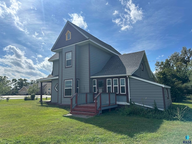 back of property featuring a lawn