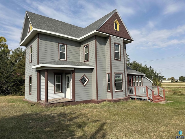 101 N Seaman St, Delmont, SD 57330 - view of front of home featuring roof with shingles and a front yard
