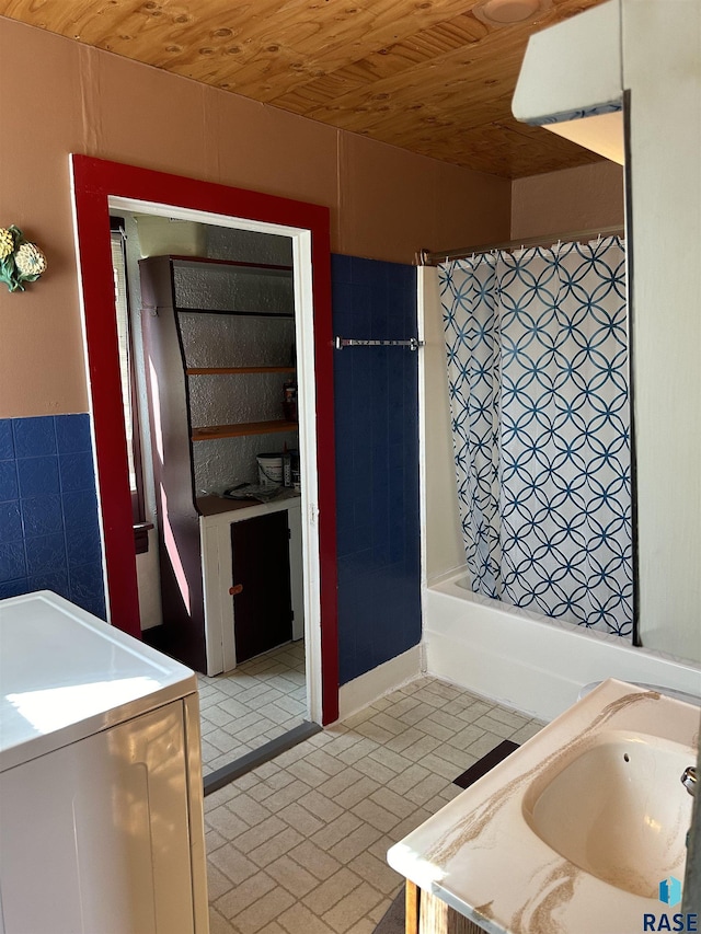 101 N Seaman St, Delmont, SD 57330 - bathroom with tile walls, washer / clothes dryer, and vanity