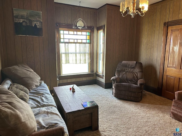 101 N Seaman St, Delmont, SD 57330 - living area with carpet flooring, wood walls, and a notable chandelier