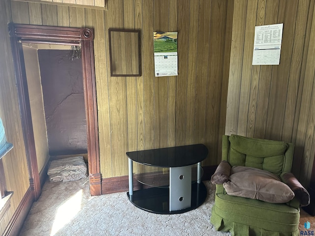 101 N Seaman St, Delmont, SD 57330 - sitting room featuring a notable chandelier, wooden walls, and carpet flooring