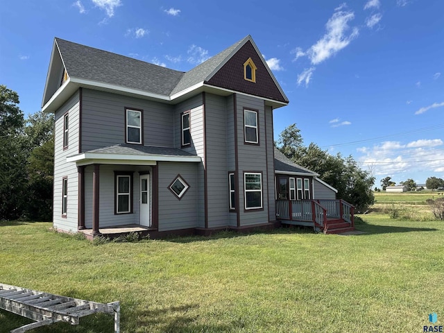 101 N Seaman St, Delmont, SD 57330 - view of side of property featuring a lawn and a shingled roof