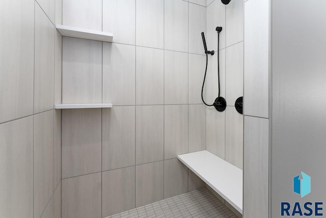 interior space featuring a tile shower