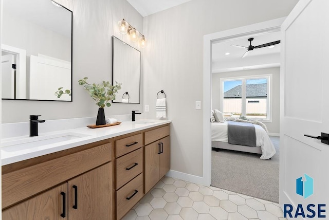 bathroom featuring ceiling fan and vanity