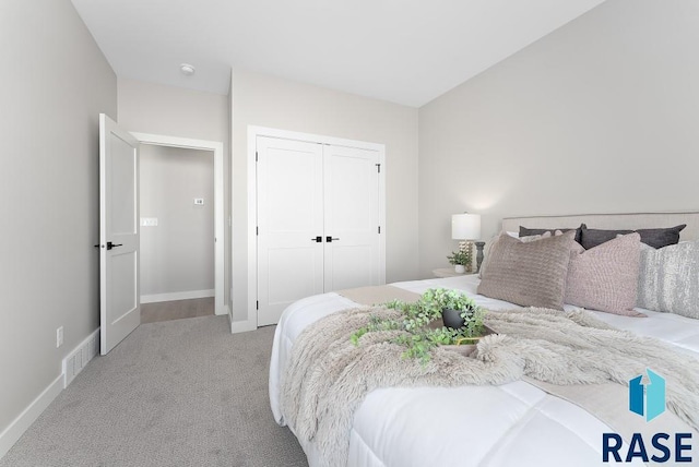 carpeted bedroom with a closet