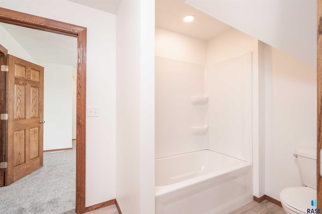 bathroom featuring toilet and shower / washtub combination