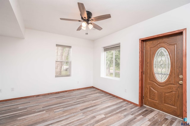 foyer featuring light wood-type flooring and ceiling fan