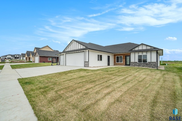 view of front of house with a front yard and a garage