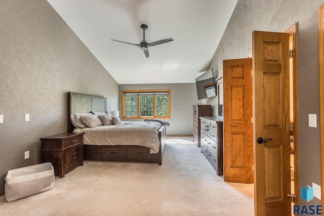 carpeted bedroom featuring vaulted ceiling and ceiling fan