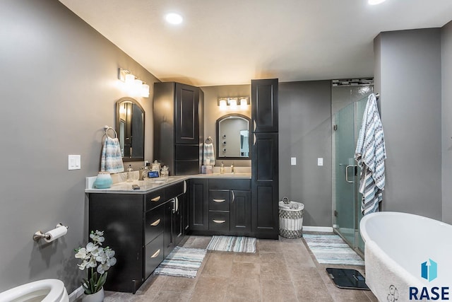 bathroom featuring vanity and separate shower and tub