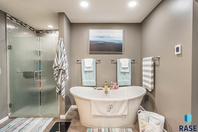 bathroom featuring independent shower and bath and tile patterned floors