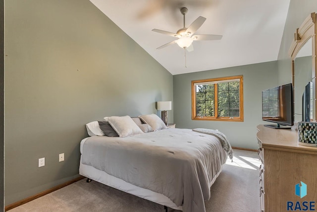 carpeted bedroom with lofted ceiling and ceiling fan