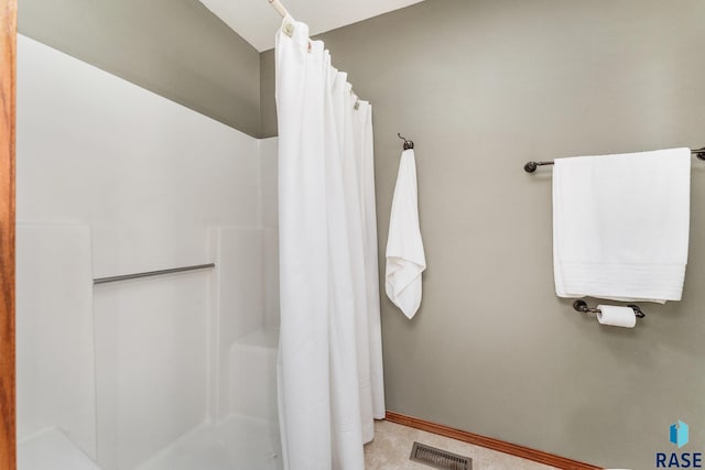 bathroom with a shower with shower curtain