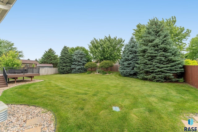 view of yard featuring a wooden deck