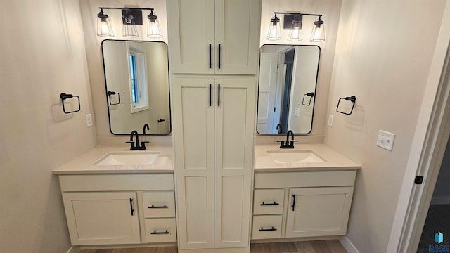 bathroom featuring hardwood / wood-style floors and vanity