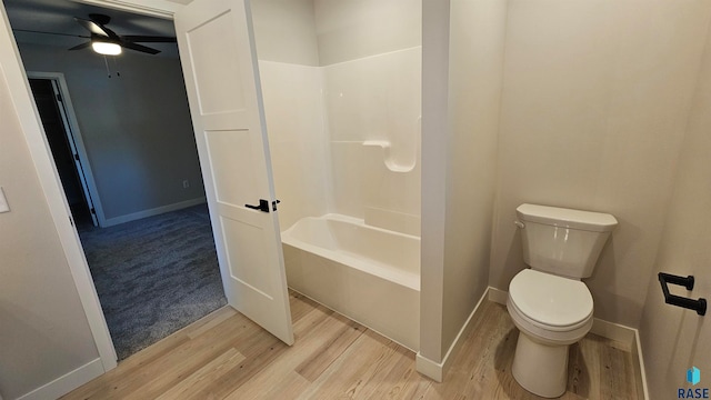 bathroom with ceiling fan, hardwood / wood-style flooring, and toilet