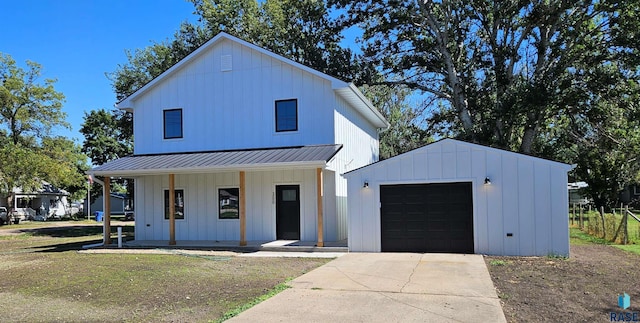 modern farmhouse with a front yard and a porch